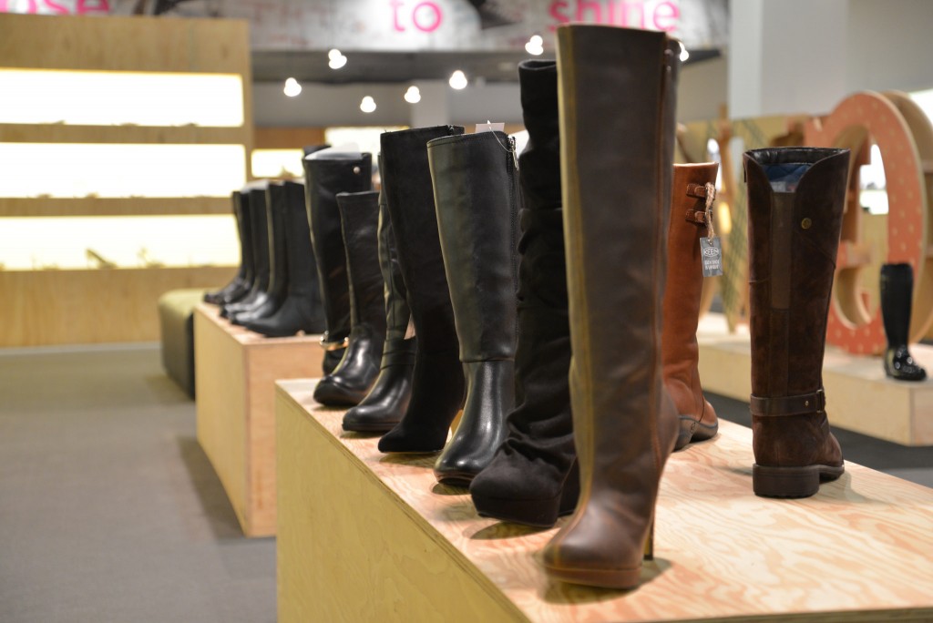 Shoe store display of boots in a Zappo's popup