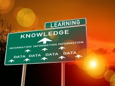 Sign showing that data becomes information, which leads to knowledge, which leads to learning