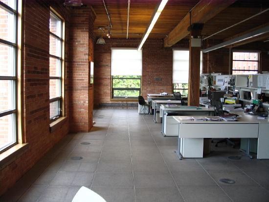 A photo shows a view of an open office.