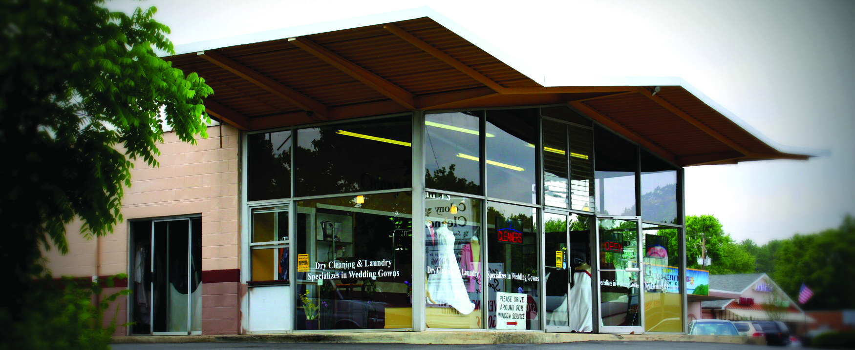 Exterior photograph of dry-cleaning business.