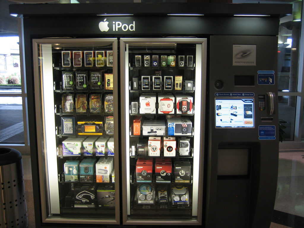 An iPod branded vending machine. The machine dispenses electronics, such as cell phones and headphones, as well as related materials, such as cell phone cases.