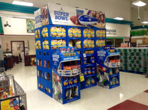 Super Bowl themed potato chip display in a grocery store