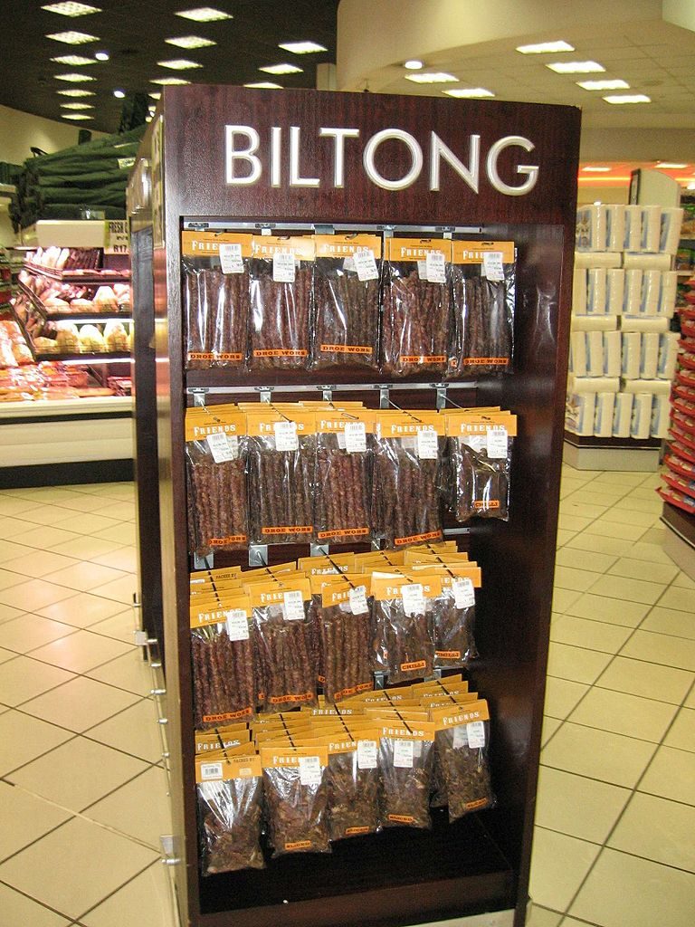 Display of a jerky brand in a grocery store with the jerky brand name in large letters at the top of the display.