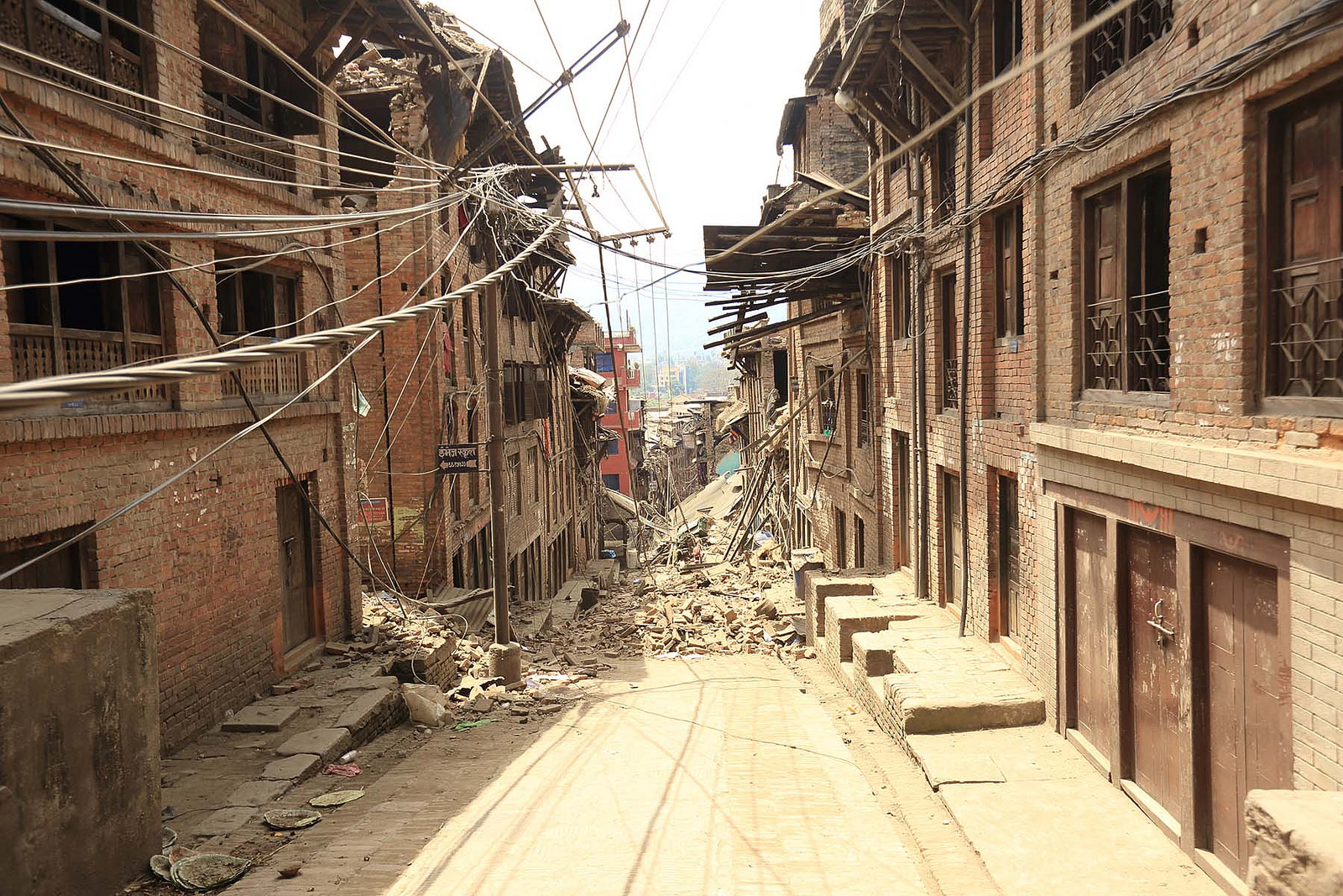 Debris blocks a street in Nepal after 2015 earthquake