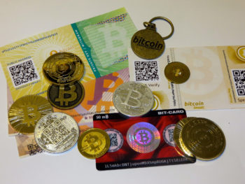 paper and coins of bitcoin