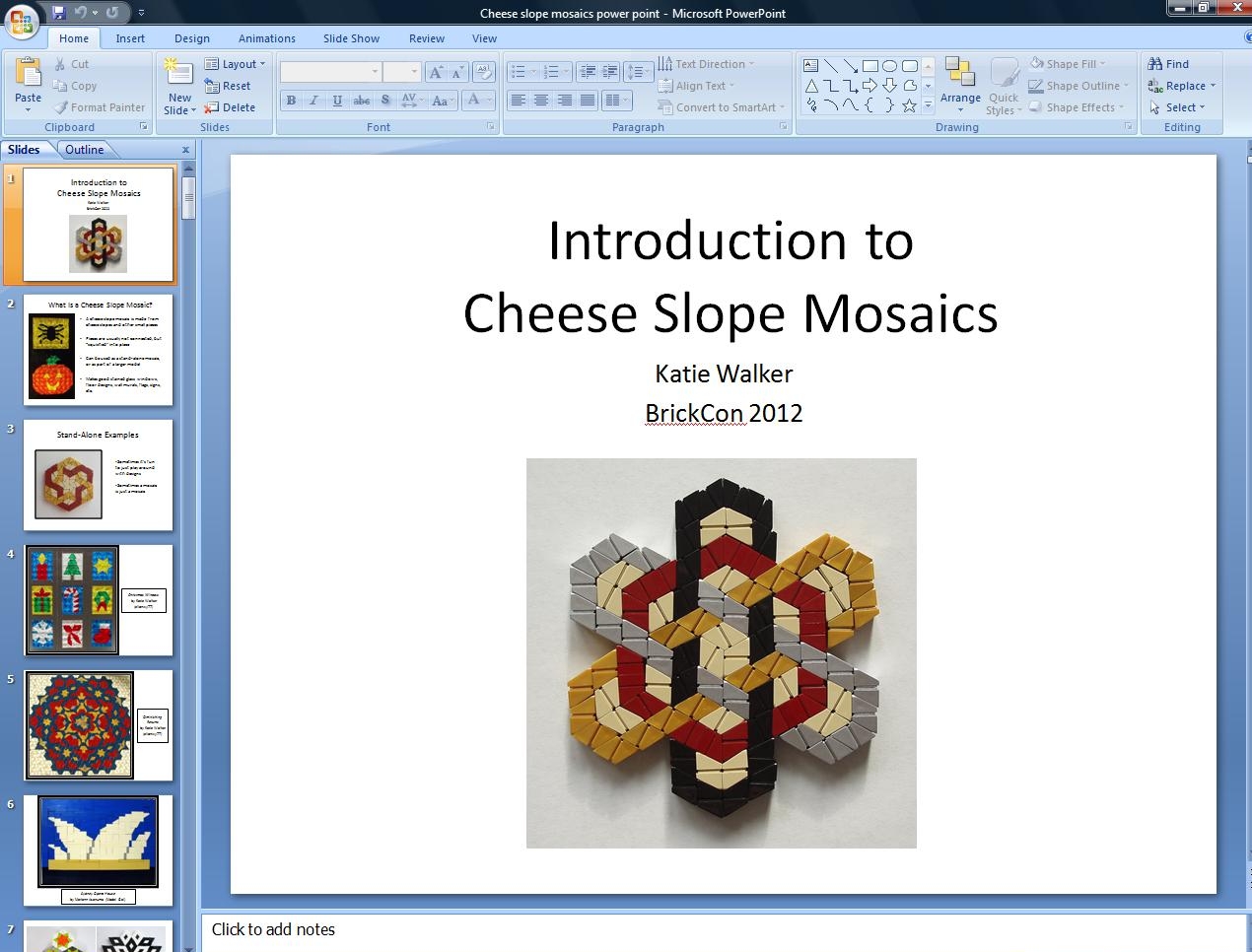 Screenshot of Microsoft PowerPoint editor. Slide has a white background and black text that says "Introduction to Cheese Slope Mosaics Katie Walker BrickCon 2012". Slide has an image of a white, grey, black, and red mosaic making a six pronged star.