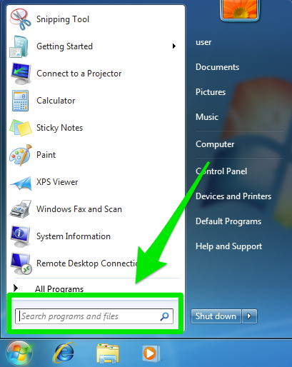Windows 7 start menu with the search programs and files highlighted by a green box and arrow.