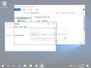 Image of a Windows 10 Desktop with two individual windows open. One is a file finder and the other is a textbook. In front of the file finder is a large red box, indicating that there is a screenshot using the snipping tool in progress specifically on the file finder.