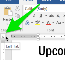 A green arrow pointing towards the left tab option on the ribbon.