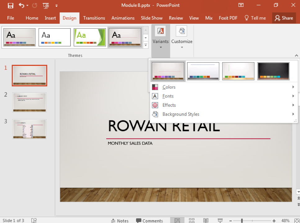 A Microsoft Powerpoint deck is open with 3 slides created. A new design feature has been added making the slide deck more visually appealing. A dropdown menu has emerged from the variants section under the design tab in the ribbon menu.