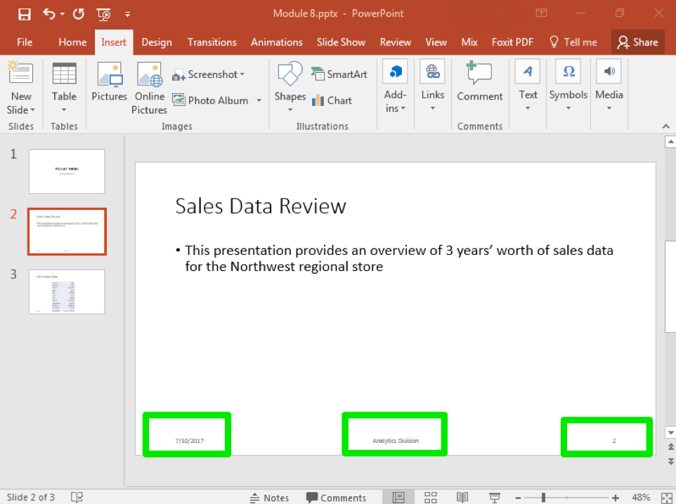 A Microsoft Powerpoint deck is open with 3 slides created. There are three green boxes on the bottom of the slide showing where the newly inserted options from the header and footer menu are. The box in the bottom left shows the date, the box in the middle shows that the footer has been set to "Analytics Division" and the box on the right shows the page number.