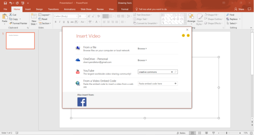 A Microsoft powerpoint is open. A insert video dialog box has opened with four options. The third option down is to search on youtube. In the youtube search section creative commons has been entered.