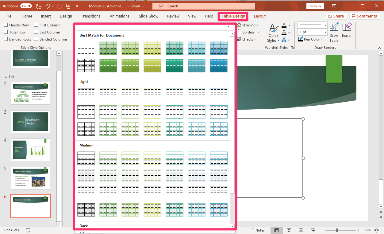 PowerPoint screenshot of open presentation with a new inserted table being drawn into the slide with style options in table design tab.