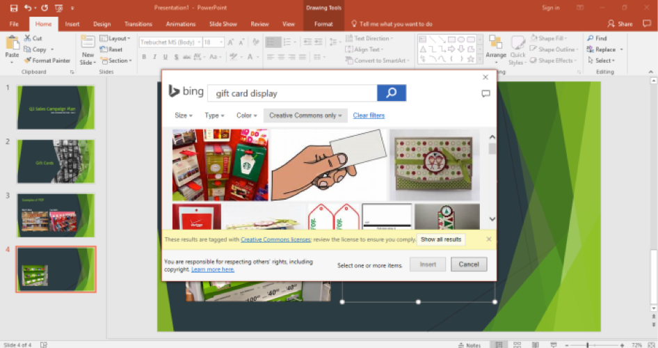 A Microsoft Powerpoint is open for a sales campaign. It is on the fourth slide of the powerpoint and a bing search for gift card display has been entered. The bing search is shown in front of the powerpoint.