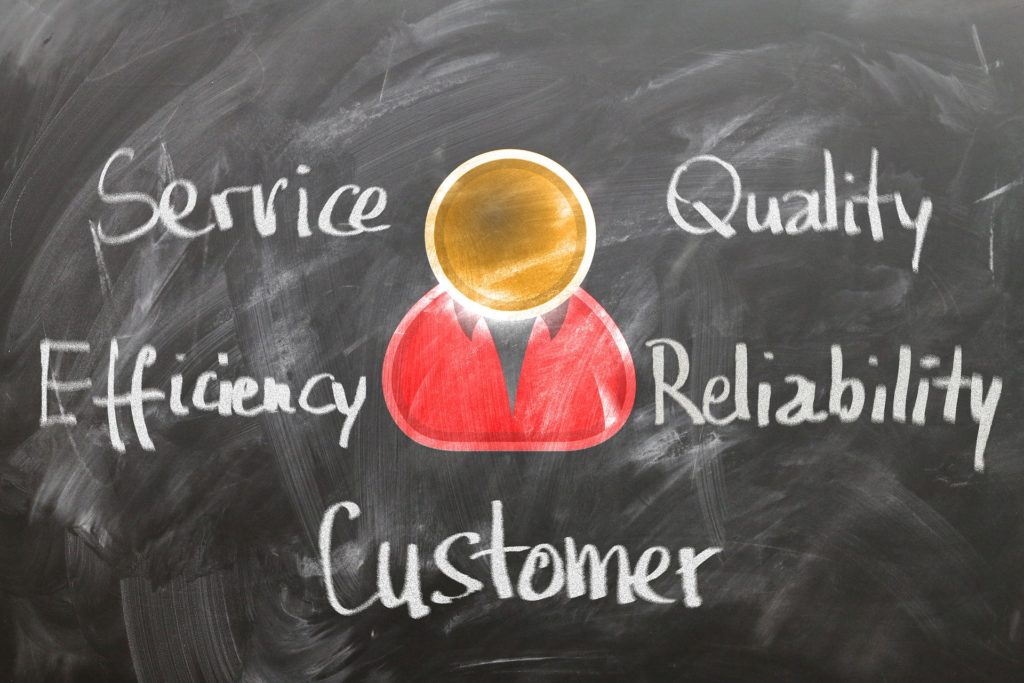 Illustration of a person wearing a red shirt. They are labelled as a customer. Written around them are the words "service," "quality," "efficiency," and "reliability."