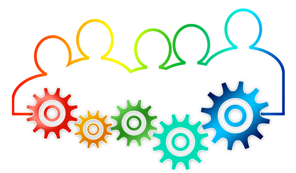 Silhouettes of five people shoulder to shoulder. There are gears beneath each individual working together. The image is a rainbow gradient.