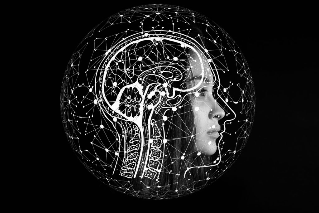 Illustration of a woman with a synthetic brain drawn over her head.