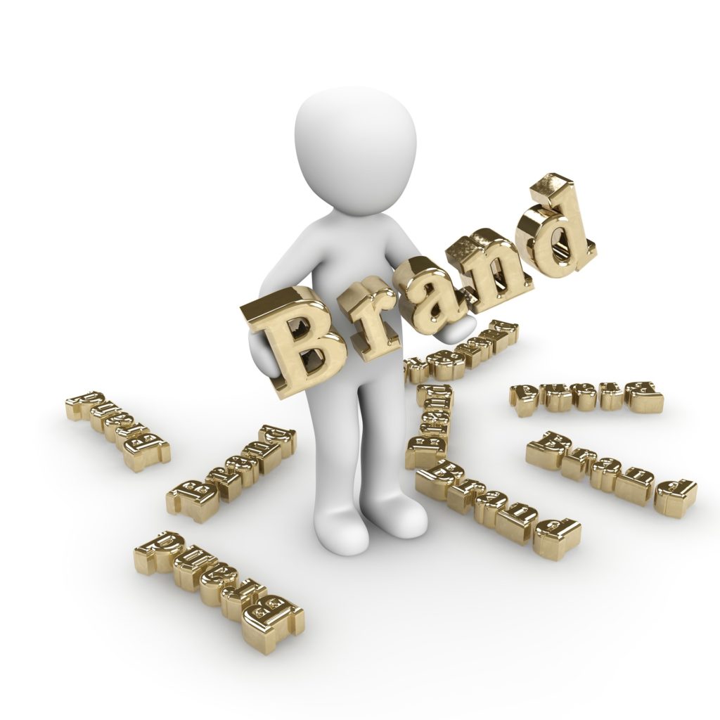 illustration of a person holding the word "Brand." There are several other smaller instances of the word "Brand" on the ground.