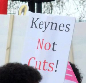A homemade sign saying "Keynes Not Cuts!"