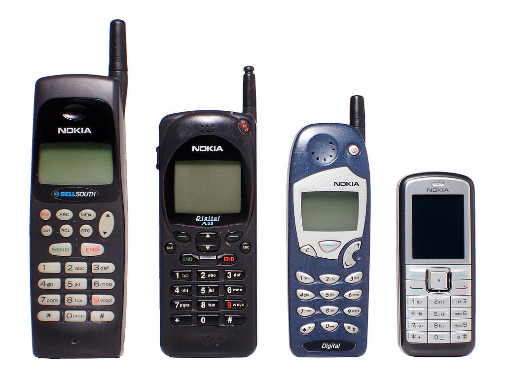 A series of four Nokia phones, showing how each model got smaller and more streamlined over the years