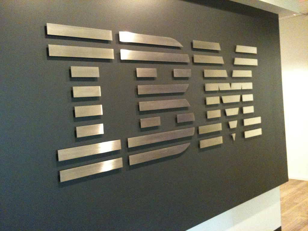The IBM logo on a gray wall