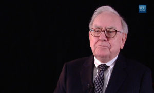 A picture of Warren Buffett with a black background