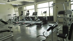 Empty fitness center with treadmills and exercise machines