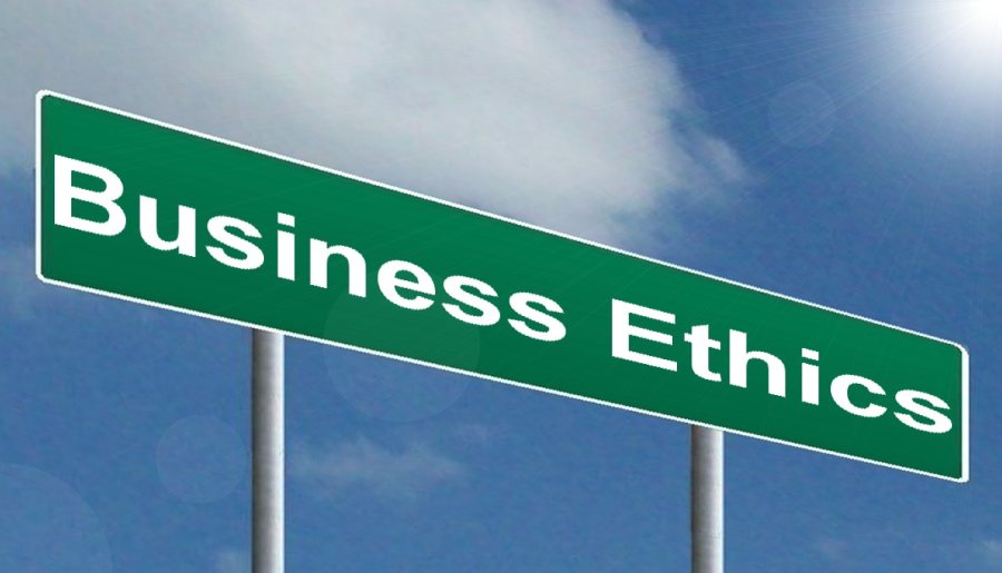 Green sign with the words “Business Ethics” on it