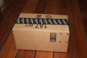 A cardboard box with Amazon tape across the top
