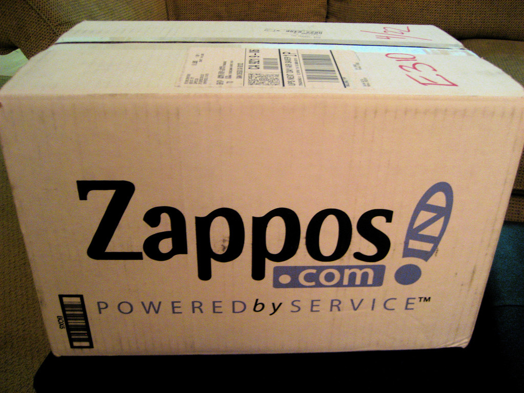 Photo of a Zappos.com shipping box with its tag line "Powered by Service."