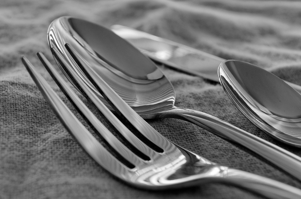 Photo of a fork, knife, and two spoons.