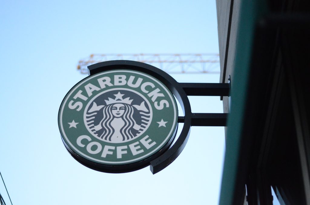 Photo of a Starbucks storefront sign.