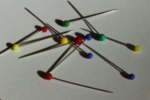 Sewing pins on a white background.