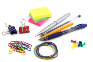 Picture of office supplies like pencils, paper clips, sticky notes, rubberbands, etc.