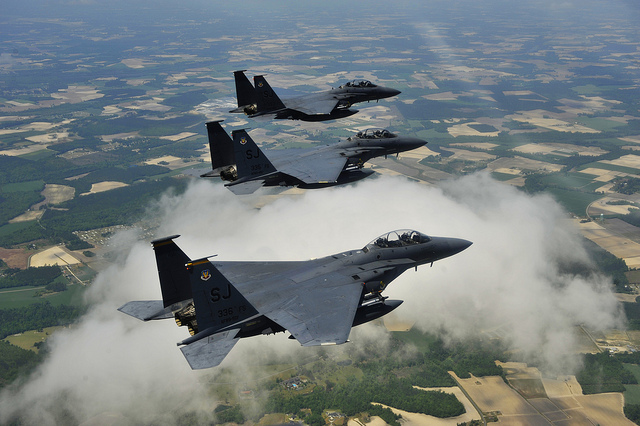 Photograph of three flying F-15 Fighters.