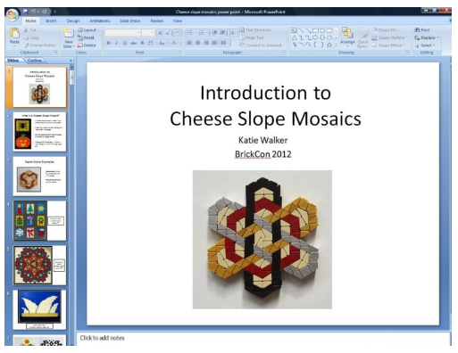 Screenshot of Microsoft PowerPoint editor. Slide has a white background and black text that says "Introduction to Cheese Slope Mosaics Katie Walker BrickCon 2012". Slide has an image of a white, grey, black, and red mosaic making a six pronged star. 