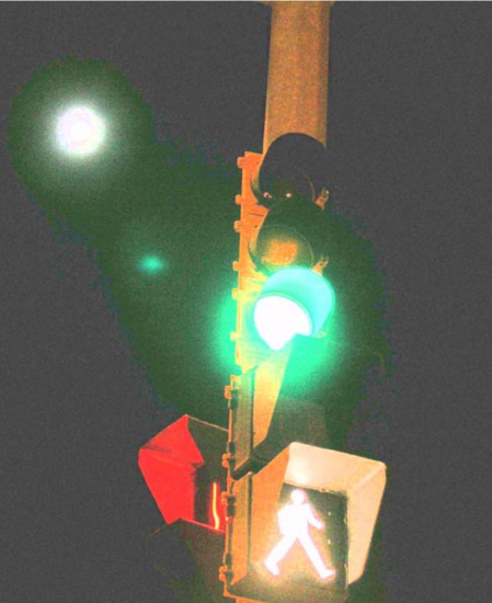 Traffic light showing green and walk