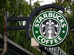 Foto de un letrero de tienda de Starbucks.