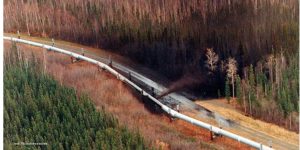 Picture of Trans-Alaska Pipeline linking oil after being shot by a high-powered rifle.