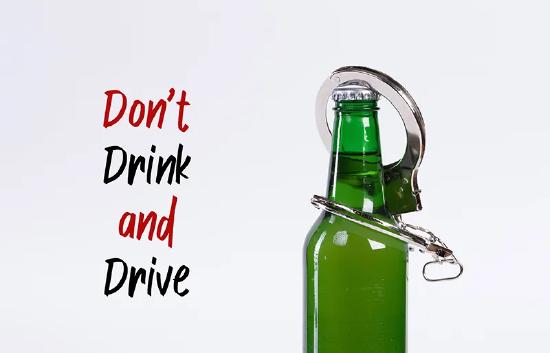 Image of handcuffs hung from the neck of a beer bottle.