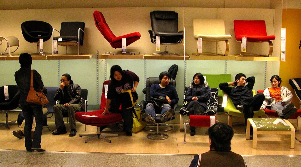 People sitting on a great variety of lounge chairs.