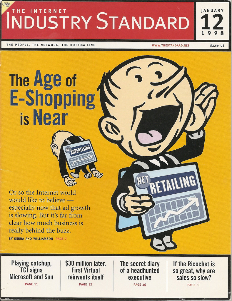 Portada de la revista 1998 Internet Industry Standard que muestra a un hombre de dibujos animados anunciando que “La era de las compras electrónicas está cerca.