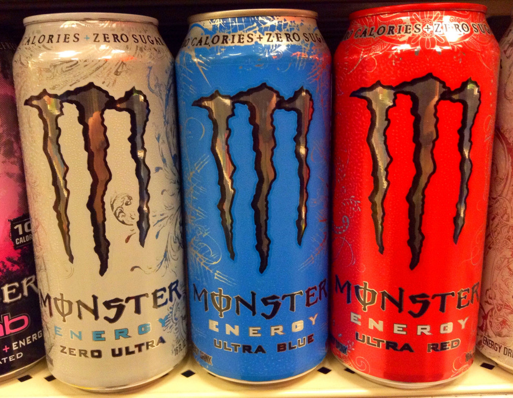 Cans of Monster Energy Drink in different colors.